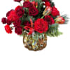 Ruby Stone Arrangement is a passionate display of heart-shaped red roses, vibrant