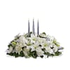 Blanket your holiday table in elegance with this lush white floral Christmas