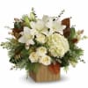 Hand-delivered in a chic bamboo cube, this extraordinary bouquet of snowy-white blooms