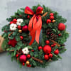 Holiday Wreath with Christmas decorations in red colors