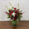 A showy and festive array of reds and whites with evergreens -