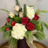 Elegant and romantic, this arrangement is the perfect winter gift for the