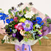 A graceful arrangement in a full spectrum of purples- soft, vibrant, and
