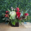 Kale white, roses red, hypericum, pom poms, wax and mini carn. 