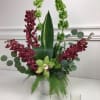 Beautiful orchids accented with chartreuse elements make a stunning design.
