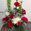 A stylish seasonal arrangement sure to bring holiday cheer to everyone. 