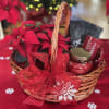 This radiant holiday basket is filled with a vibrant red poinsettia, a