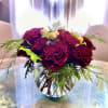 High petal count heart red roses and gold accents in a bowl-shape
