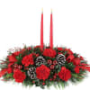  Classic centrepiece arrangement with a red taper candle, featuring long-lasting red