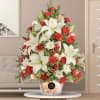 Illuminate the holiday spirit with our enchanting Christmas tree-inspired arrangement. Crafted with