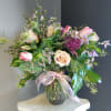 A beautifully selected bunch of the freshest flowers in a vase uniquely
