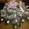 Pink roses,  greens, and baby&#039;s breath. 

Banner - $15.00 + extra

Substitutions