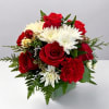 The Holiday Sparkle Bouquet is a festive blend of classic Christmas colors