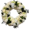 A timeless sympathy wreath designed with soft white and cream blooms, including