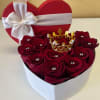 This gorgeous heart-shaped box is filled to the brim with roses. Adorned