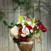 Vibrant red roses, white orchids (when in season), and other holiday joy