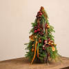 This festive evergreen tree arrangement brings a rich, luxurious holiday mood to