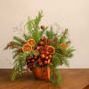 Warm, aromatic, and beautifully textured, this luxury holiday centerpiece blends fresh evergreen