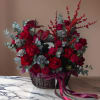 Elevate any celebration with this breathtaking arrangement of luxurious red roses and