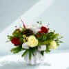 Winter Wonderment is a festive and luxurious floral arrangement that captures the