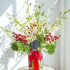 Let it snow floral arrangement featuring elegant white orchids nestled among fragrant