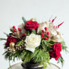 Mele Kalikimaka floral arrangement features a luxurious blend of classic red roses