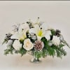 Celebrate the season with timeless elegance. This all-white floral arrangement features fresh