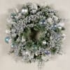 A holiday wreath decked with silver bells and iridescent globes. 
If you&#039;re