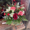 And adorable, clear, read, bass, dressed with winterberry, peppermint carnations, roses and
