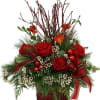 A festive floral arrangement for the Christmas season with red roses, white