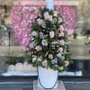 Christmas tree with pink flowers and ornaments 