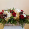 Red and white flowers decorating your holiday table with seasonal details. If