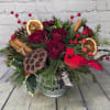 A natural take on the traditional Christmas bouquet, our &quot;Woodland Christmas&quot; arrangement