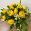 COMBINATIONS OF YELLOW RANUNCULUS and HELLEBORES IN A BEAUTIFUL CERAMIC VASE