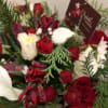 Lovely holiday centerpiece in red, white and green hues presented in a