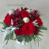 A classic holiday centerpiece designed to bring warmth and festive charm to