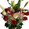 Beautiful bouquet with red roses and Pink Lilies. The colors of the