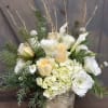 This elegant arrangement is a perfect accent to a candle lit Holiday