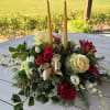 A beautiful Christmas centerpiece with two taper candles