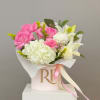 A curated mix of pink and white lilies, roses, carnations, and spider