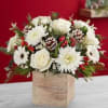 All white flowers with red berries and pine cones