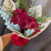 Deep red blooms with a sprinkle of sparkles wrapped in floral paper