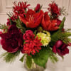 A gorgeous array of premium Dutch flowers and assorted evergreen foliage is