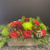 Red and green flowers in a wooden box
