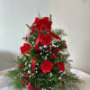 Fresh cut flowers and greenery with ribbons and ornaments to make this
