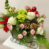 This Arrangement is Designed in a Metal Tin Sleigh with Christmas Greens