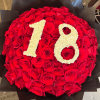 100 perfect, long-stemmed roses, meticulously arranged to create a breathtaking dome of