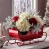 Celebrate the season with this charming holiday sleigh overflowing with fresh winter