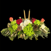 A festive container arrangement featuring lush green hydrangeas, radiant red roses, striking