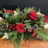 Celebrate The Holiday with this elegant centerpiece.  . Red roses 